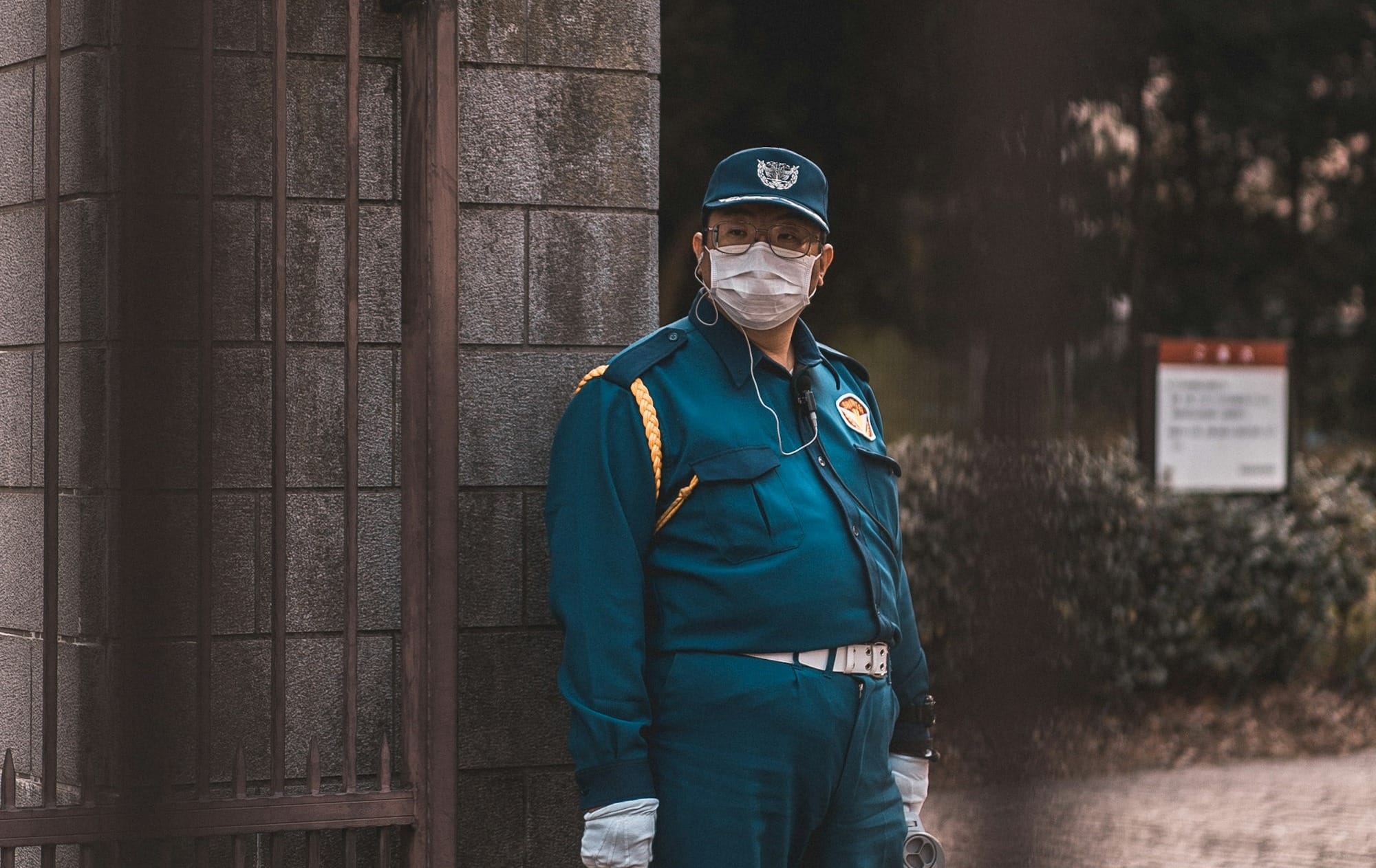 man standing concrete gate