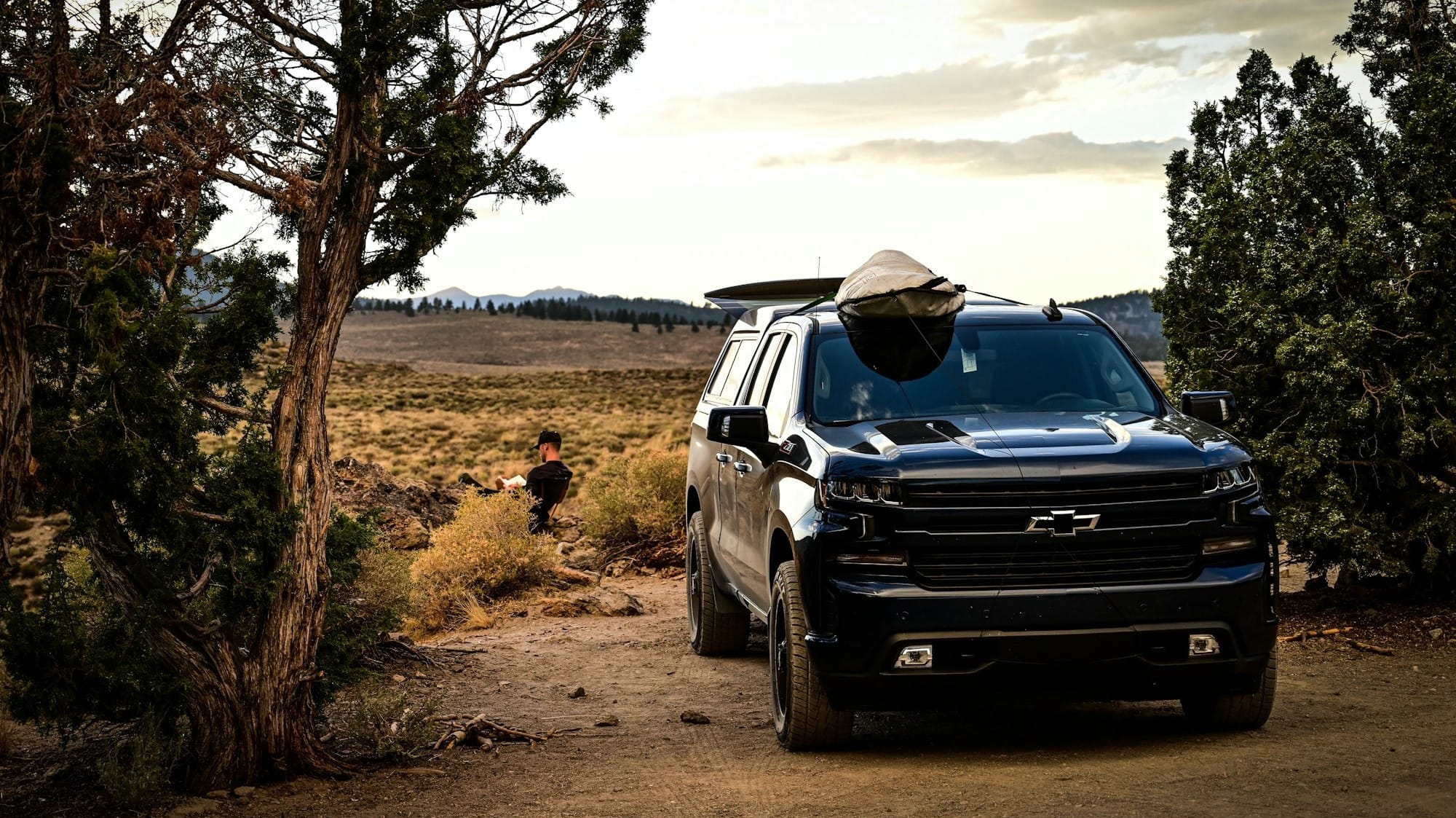 black suv on dirt road during daytime