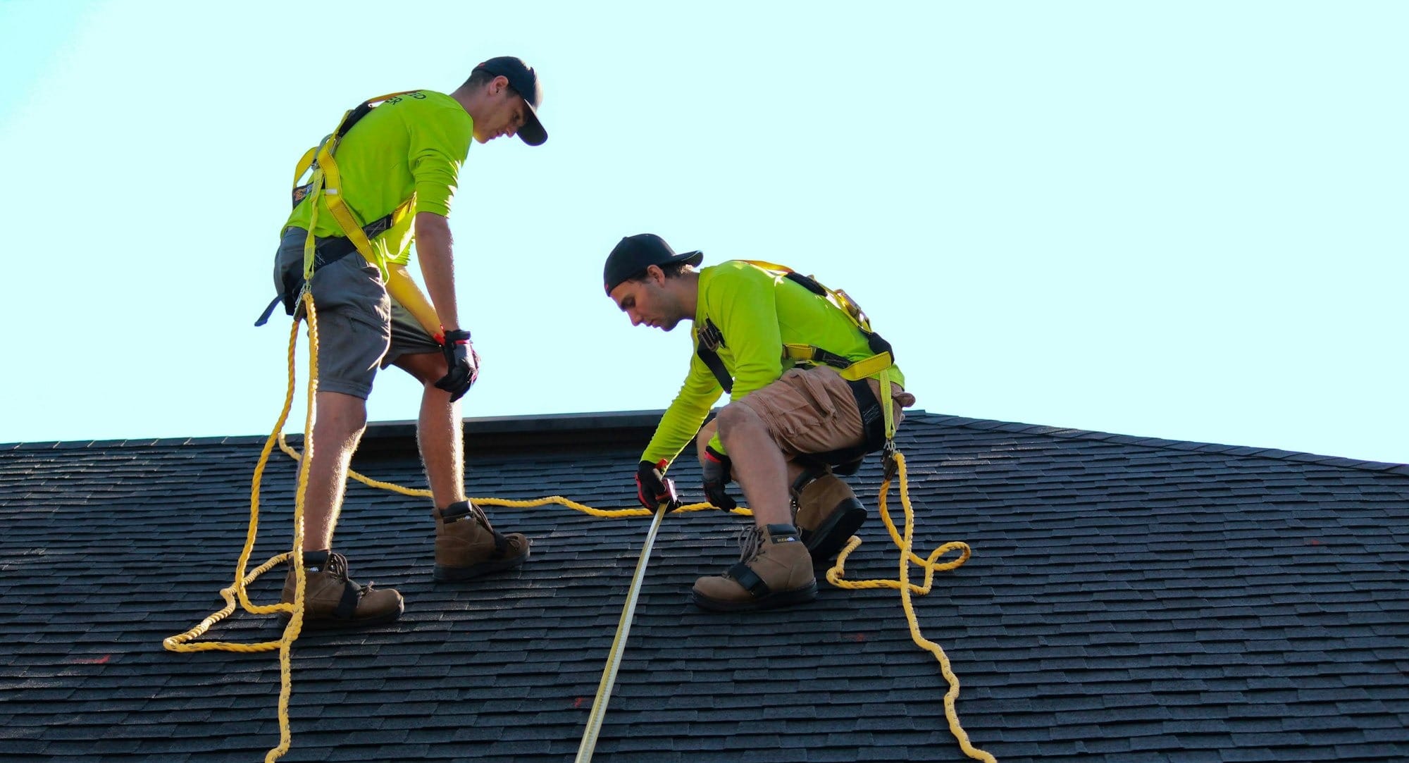 a couple of people that are on a roof